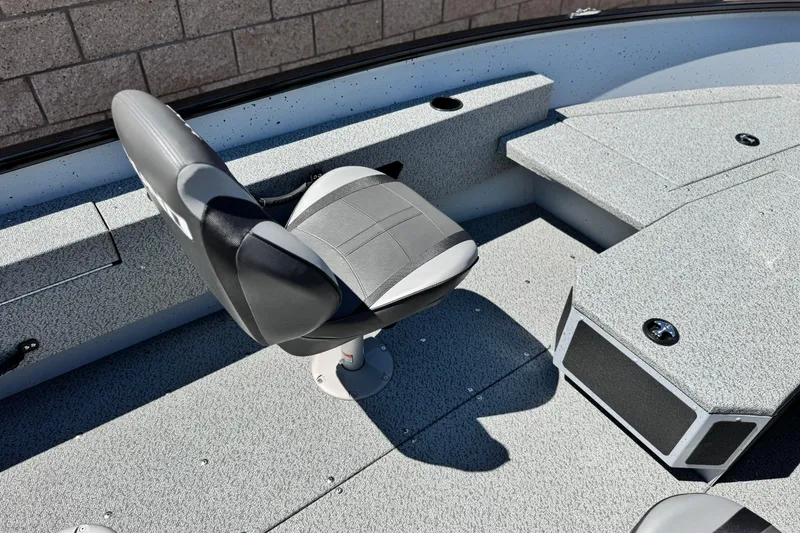 Slide: The Image of 2024 Lund 1775 Adventure Sport boat interior with gray seating and storage compartments. - 16