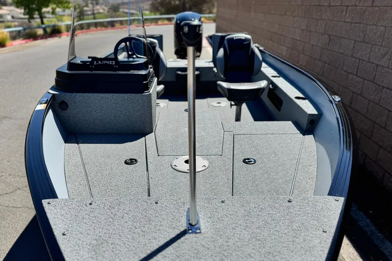 Slide: The Image of 2024 Lund 1775 Adventure Sport boat, interior view with seating and steering console. - 6