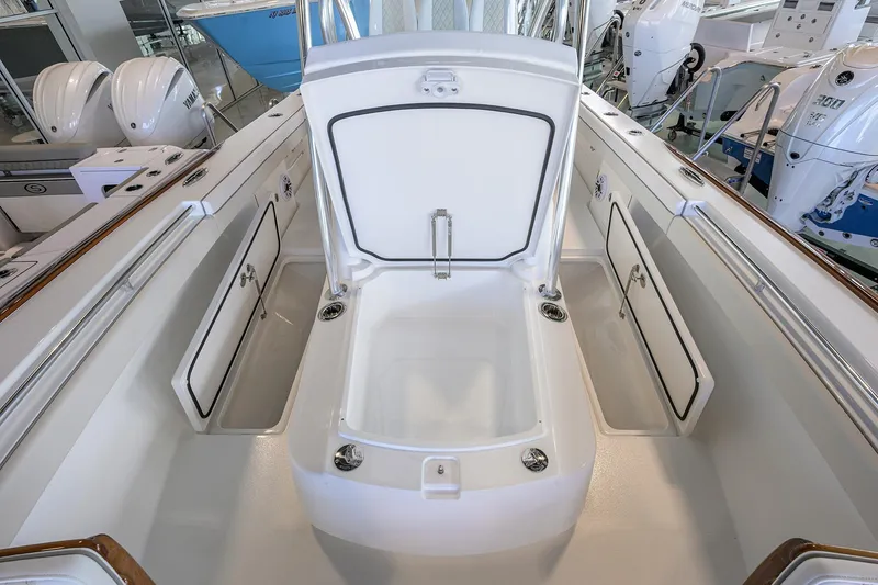 Slide: The Image of 2026 Valhalla V-29 boat interior with open storage compartments and sleek design. - 10