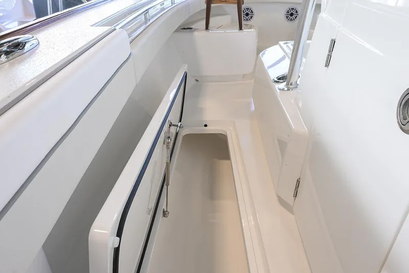 Slide: The Image of 2026 Valhalla V-29 boat interior with open storage compartment and sleek white design. - 13