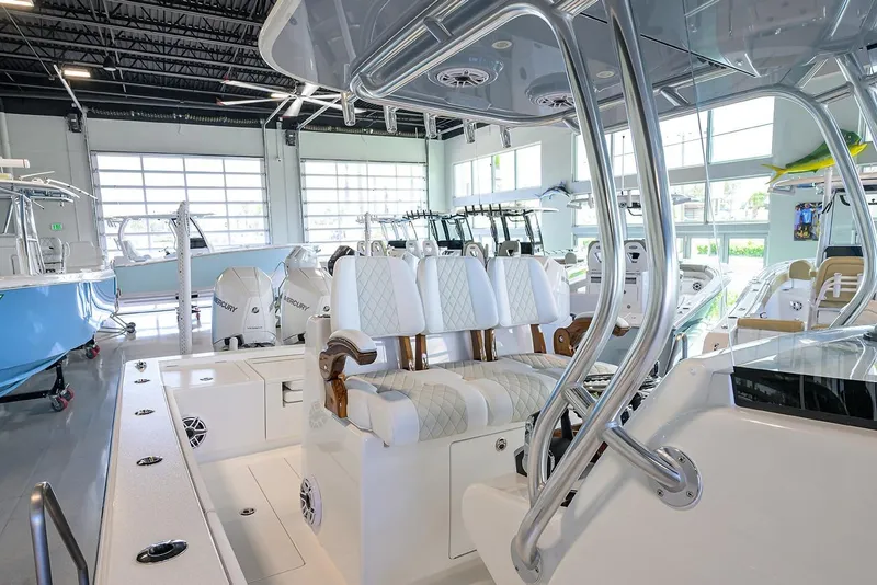 Slide: The Image of 2026 Valhalla V-29 boat interior with luxurious seating in a showroom. - 16