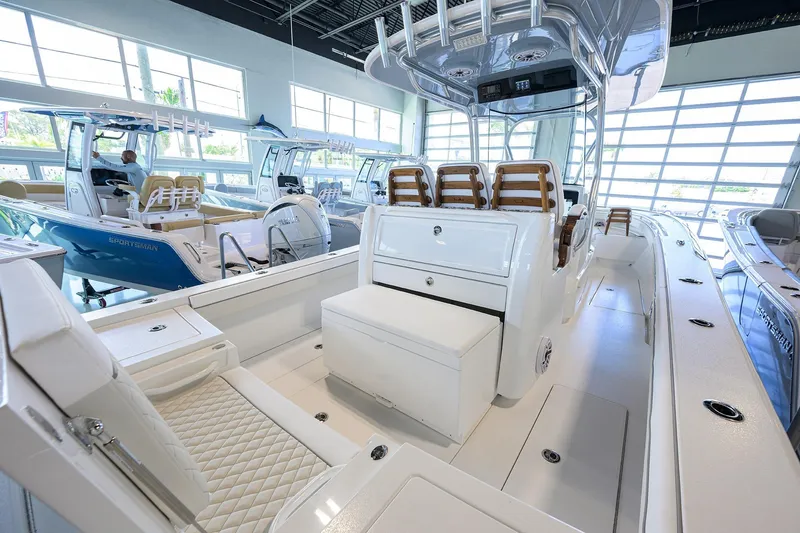 Slide: The Image of 2026 Valhalla V-29 boat interior with sleek seating and modern design in showroom. - 20