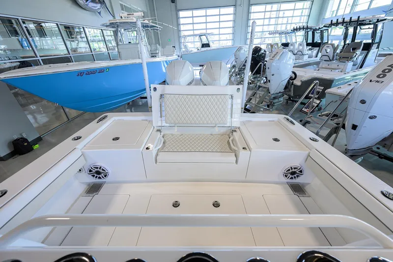 Slide: The Image of 2026 Valhalla V-29 boat interior with seating and storage in a showroom. - 22