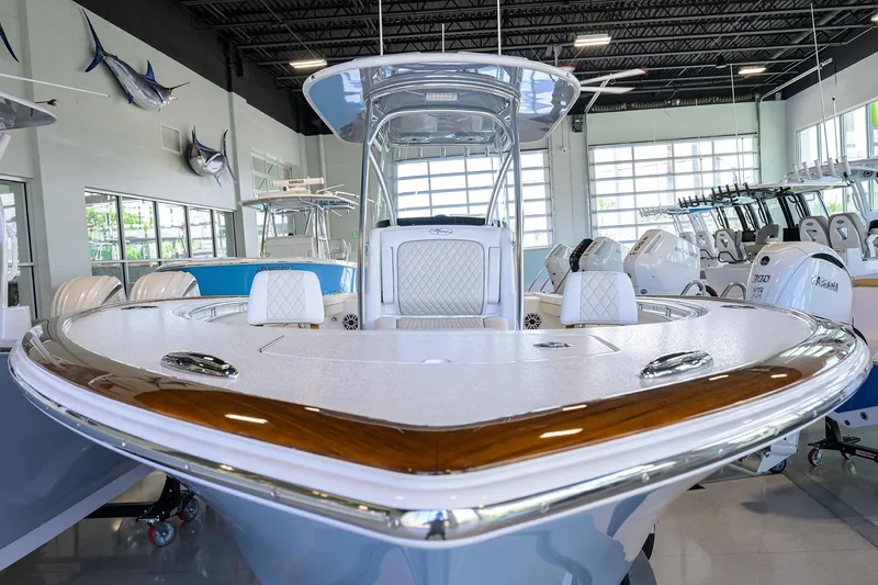 Slide: The Image of 2026 Valhalla V-29 boat displayed in a showroom with sleek design and modern features. - 3