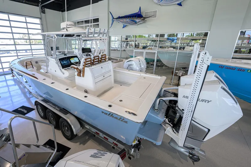 Slide: The Image of 2026 Valhalla V-29 boat in showroom, featuring sleek design and advanced technology. - 5