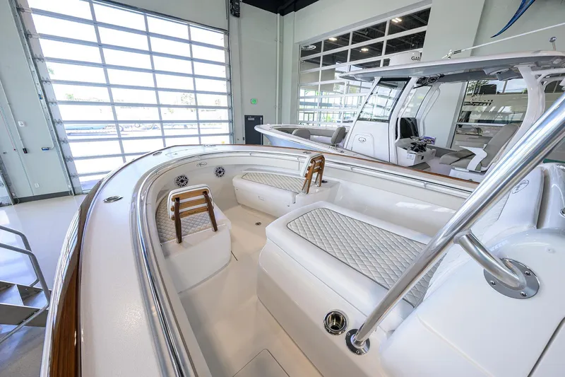 Slide: The Image of 2026 Valhalla V-29 boat interior with luxurious seating and modern design in showroom. - 7