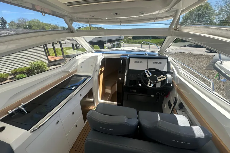 Slide: The Image of Interior of 2023 Nimbus Weekender 9 boat with modern helm and seating. - 25