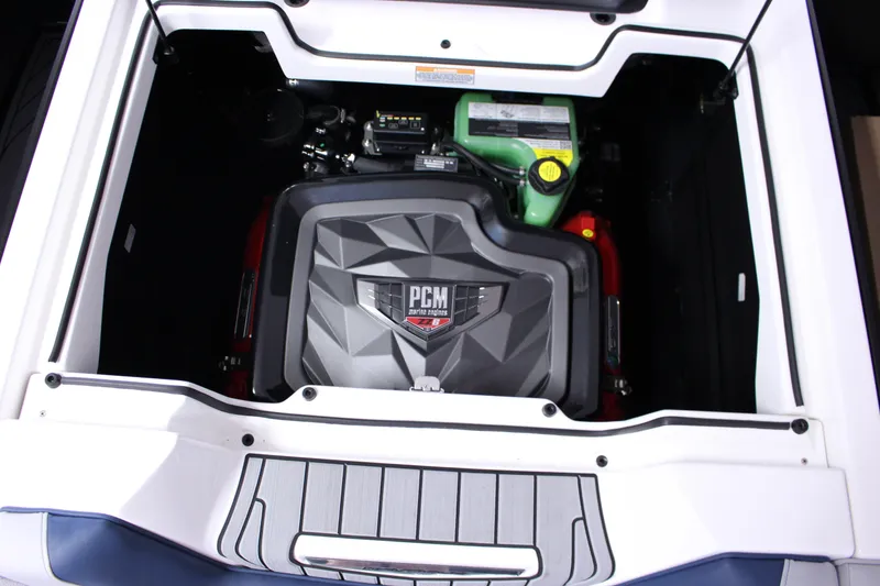 Slide: The Image of 2024 Nautique G25 engine compartment with PCM marine engine, showcasing advanced design. - 13