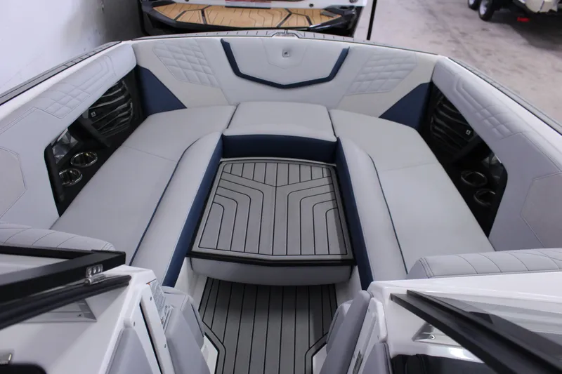 Slide: The Image of 2024 Nautique G25 boat interior with luxurious seating and modern design. - 5