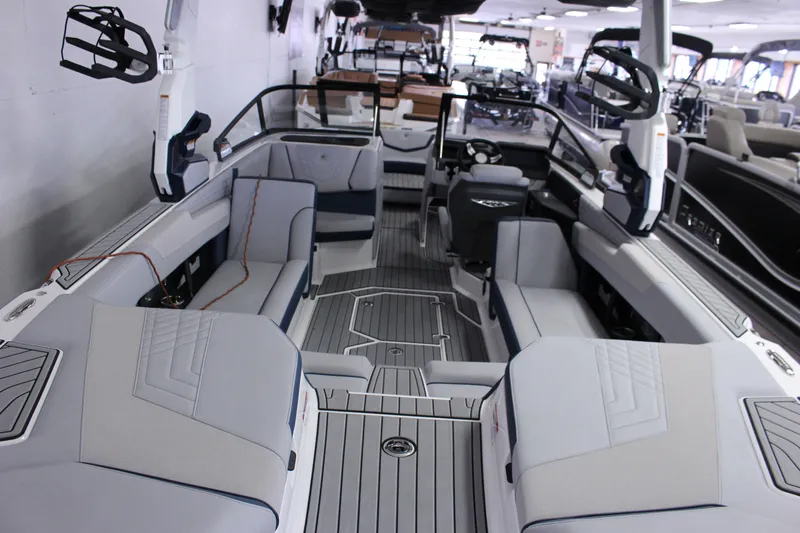 Slide: The Image of 2024 Nautique G25 boat interior with spacious seating and modern design. - 6