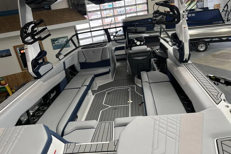 Slide: The Image of 2024 Nautique G25 boat interior with spacious seating and modern design. - 7