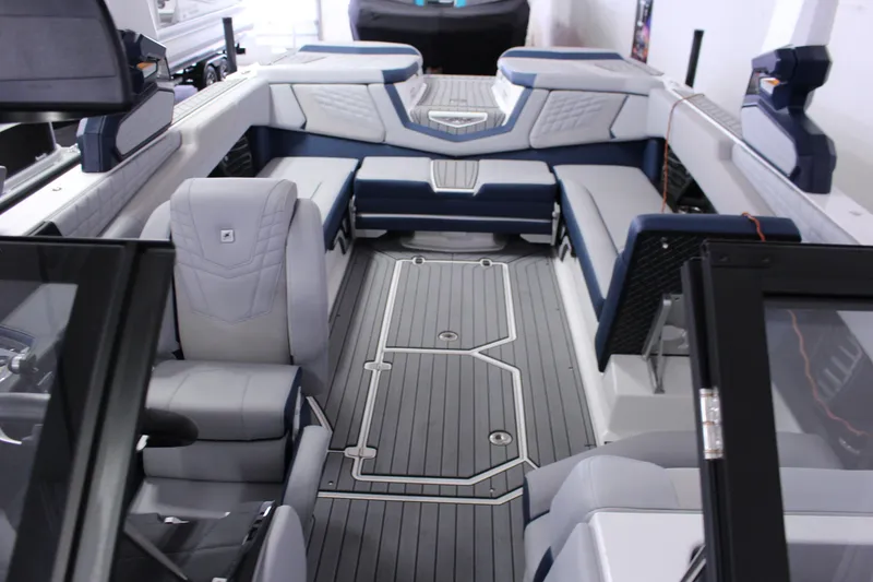 Slide: The Image of 2024 Nautique G25 boat interior with luxurious seating and modern design. - 9