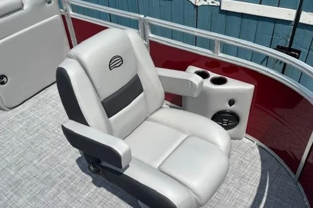 Slide: The Image of Luxury seating on 2026 Sun Tracker SportFish 20 DLX pontoon boat, featuring cup holders and speaker. - 13