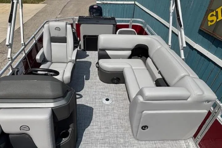 Slide: The Image of 2026 Sun Tracker SportFish 20 DLX pontoon boat with gray seating and modern interior design. - 14