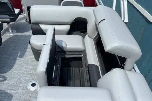 Slide: The Image of 2026 Sun Tracker SportFish 20 DLX boat interior with gray cushioned seating and storage compartments. - 18