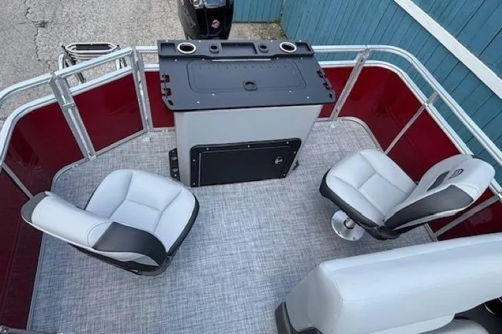 Slide: The Image of 2026 Sun Tracker SportFish 20 DLX boat interior with seating and control panel. - 25