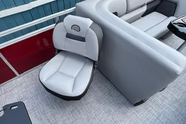 Slide: The Image of 2026 Sun Tracker SportFish 20 DLX boat interior with gray seating and modern design. - 28