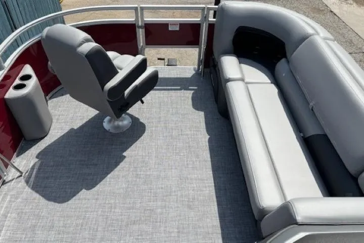 Slide: The Image of 2026 Sun Tracker SportFish 20 DLX pontoon boat interior with seating and captain's chair. - 9