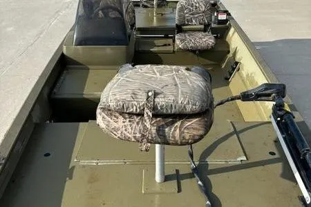Slide: The Image of 2012 Tracker 1860 Grizzly boat with camouflage seats and steering console. - 5