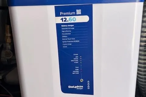 Slide: The Image of Premium Dolphin battery charger on 2020 Grady-White Freedom 275 boat, featuring automatic voltage management. - 13