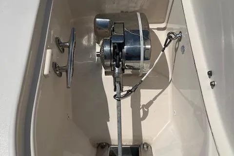 Slide: The Image of 2020 Grady-White Freedom 275 boat anchor compartment with winch and cleat. - 3