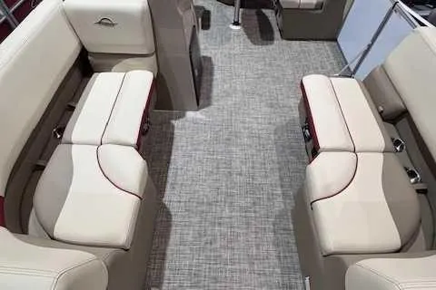 Slide: The Image of 2025 SunCatcher Select 16C boat interior with beige seating and gray carpet. - 3