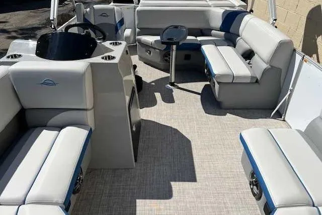 Slide: The Image of 2025 SunCatcher Select 18C pontoon boat interior with plush seating and modern design. - 3
