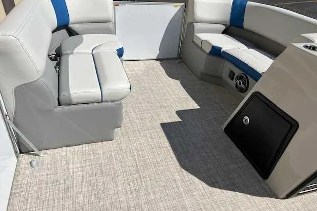 Slide: The Image of Interior of 2025 SunCatcher Select 18C pontoon boat with gray and blue seating. - 5