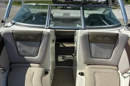 Slide: The Image of 2011 Sea Ray 210 SLX boat interior with beige seating and windshield. - 5