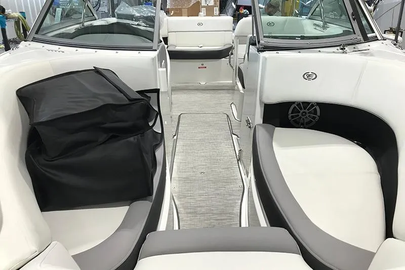 Slide: The Image of 2024 Cobalt 220S boat interior with white and gray seating, modern design. - 4