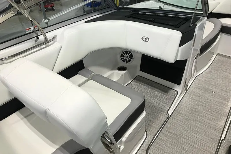 Slide: The Image of 2024 Cobalt 220S boat interior with white seating and modern design. - 6