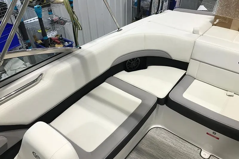 Slide: The Image of 2024 Cobalt 220S boat interior with white and gray seating, showcasing luxury design. - 7