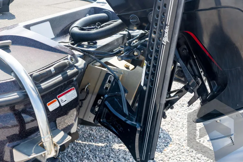 Slide: The Image of 2020 Nitro Z21 boat engine and components close-up on gravel surface. - 25