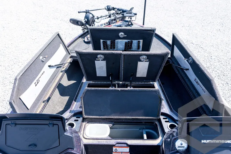 Slide: The Image of 2020 Nitro Z21 boat interior with open storage compartments and fishing equipment. - 39