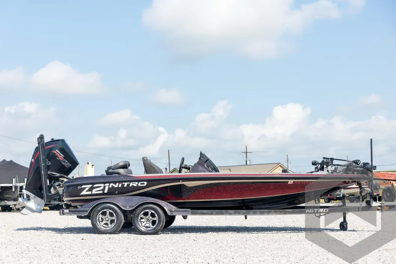 Slide: The Image of 2020 Nitro Z21 boat on trailer under blue sky. - 4