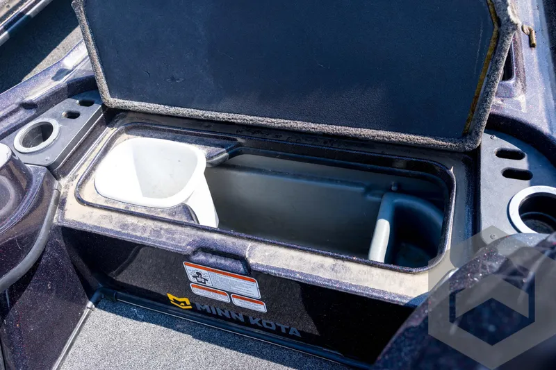 Slide: The Image of Open storage compartment in 2020 Nitro Z21 boat with Minn Kota branding. - 42