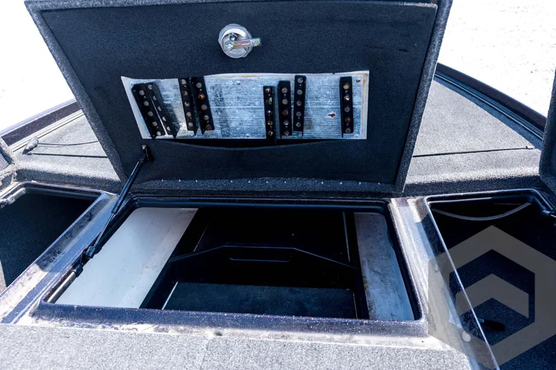 Slide: The Image of Open storage compartment in 2020 Nitro Z21 boat, featuring organized panel and spacious interior. - 44
