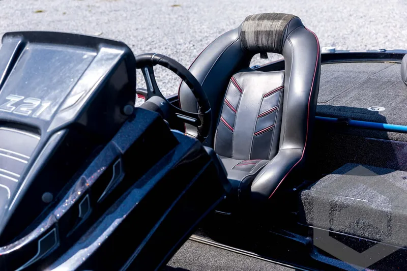 Slide: The Image of 2020 Nitro Z21 boat interior with sleek black leather seating and steering wheel. - 47
