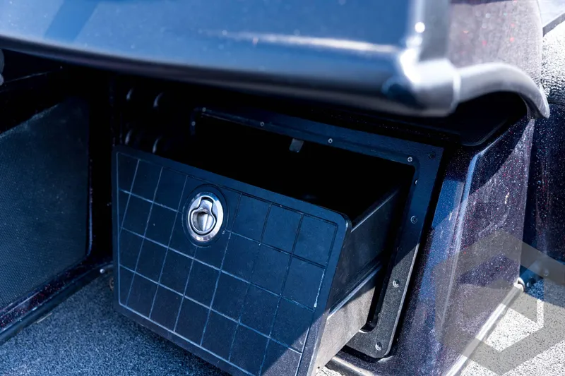 Slide: The Image of 2020 Nitro Z21 boat storage compartment with secure latch, open for access. - 52