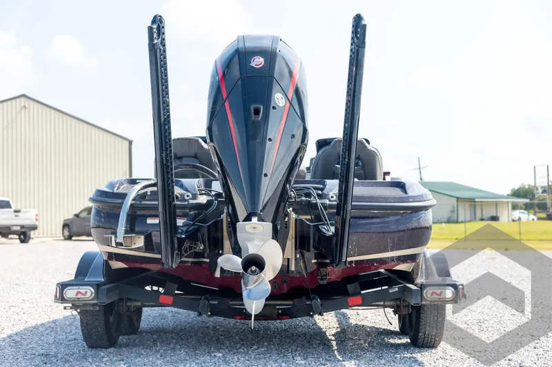Slide: The Image of 2020 Nitro Z21 boat rear view with motor and trailer in outdoor setting. - 6