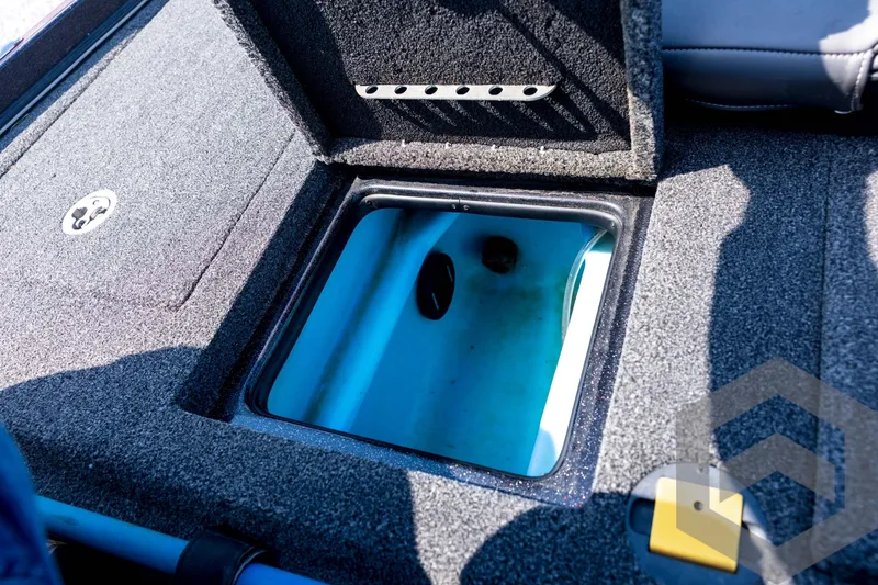 Slide: The Image of 2020 Nitro Z21 boat livewell compartment with open lid, showcasing interior details. - 61