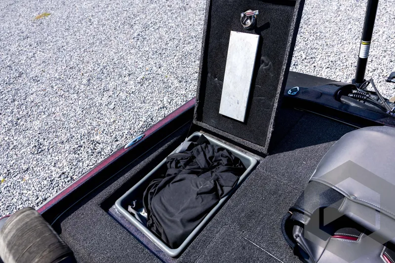 Slide: The Image of Open storage compartment in 2020 Nitro Z21 boat, showing interior with black fabric. - 63