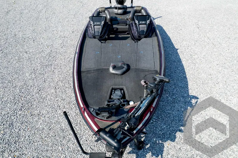 Slide: The Image of 2020 Nitro Z21 bass boat on gravel, featuring dual seats and advanced fishing equipment. - 79
