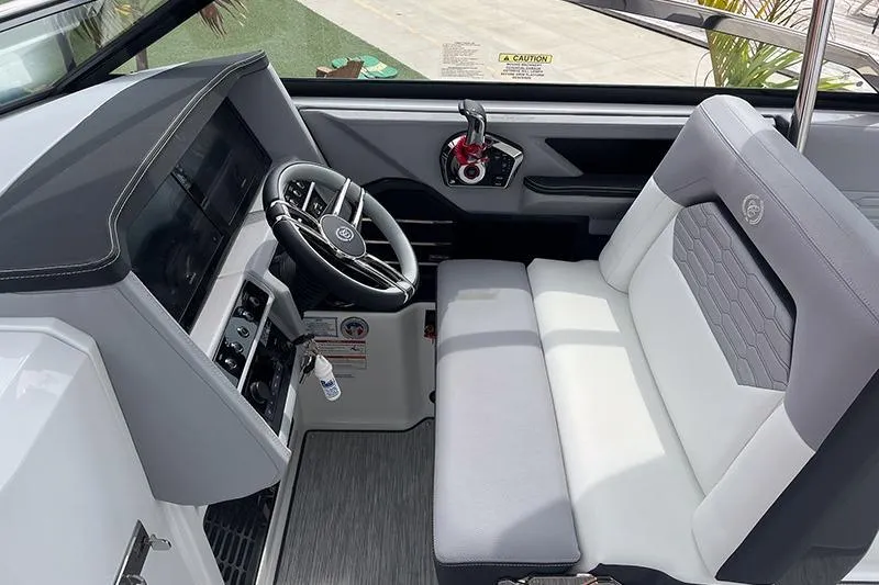 Slide: The Image of 2024 Cobalt A29 boat interior with modern steering and comfortable seating. - 5