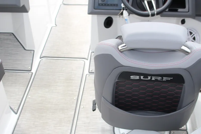 Slide: The Image of 2024 Cobalt R4 Surf boat interior with stylish seating and modern dashboard design. - 14