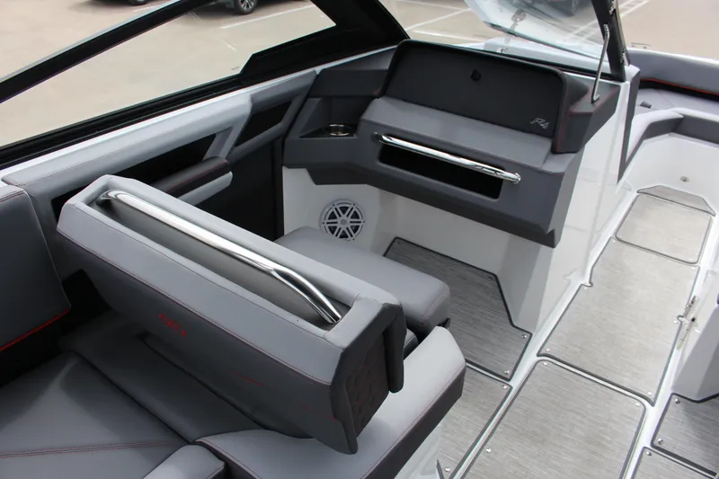 Slide: The Image of 2024 Cobalt R4 Surf boat interior with sleek gray seating and modern dashboard design. - 15