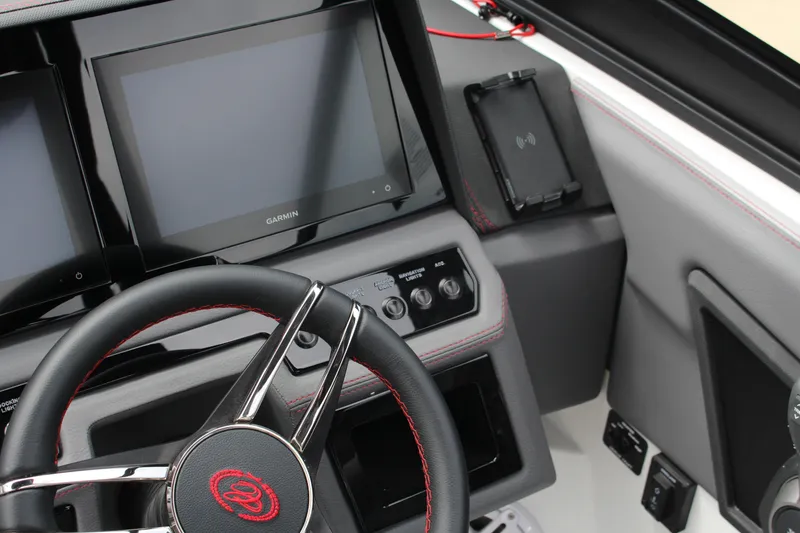 Slide: The Image of 2024 Cobalt R4 Surf dashboard with Garmin displays and steering wheel detail. - 29