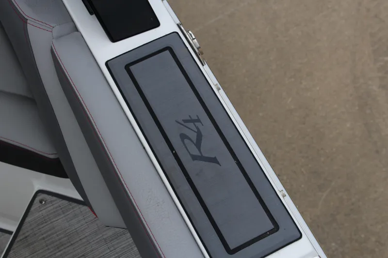 Slide: The Image of 2024 Cobalt R4 Surf boat interior detail with logo on seat panel. - 37