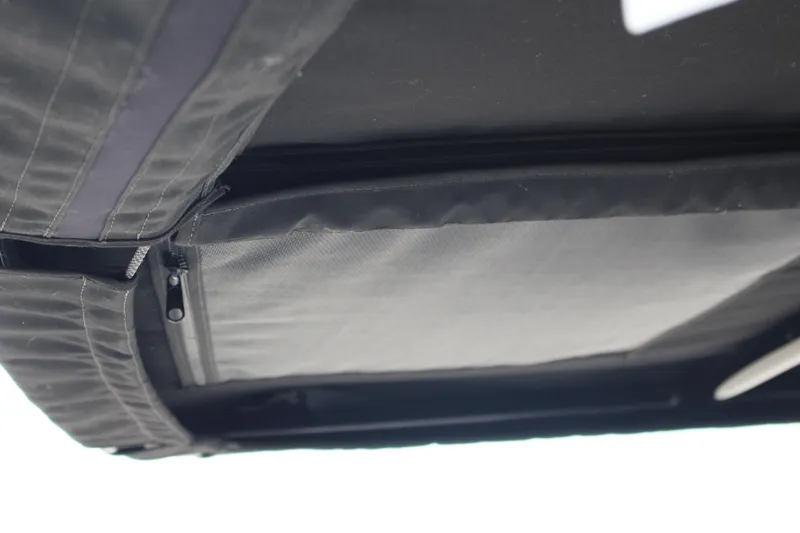 Slide: The Image of 2024 Cobalt R4 Surf boat interior detail with zippered compartment. - 38