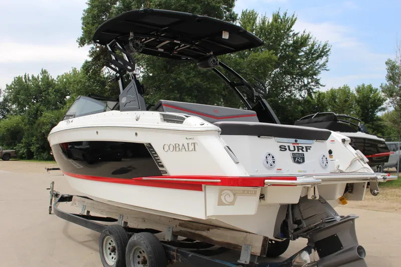 Slide: The Image of 2024 Cobalt R4 Surf boat on trailer, featuring sleek design and modern features. - 41